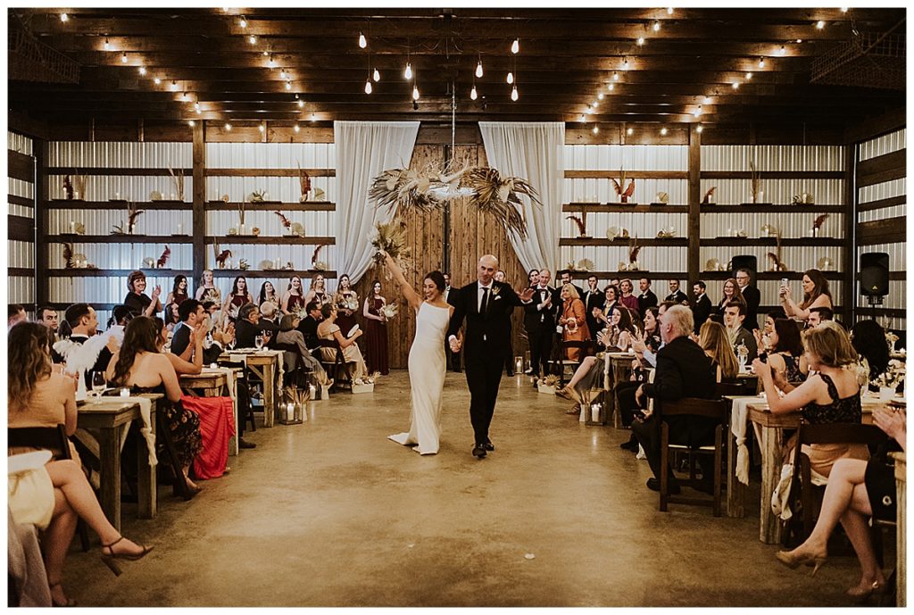 bride and groom just married inside allen farmhaus venue