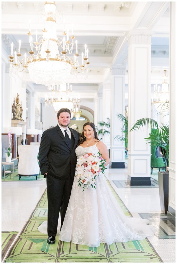 bride and groom in Peacock Alley at the St. Anthony