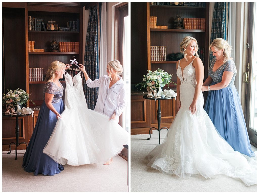 bride with mother in bridal suite with wedding dress