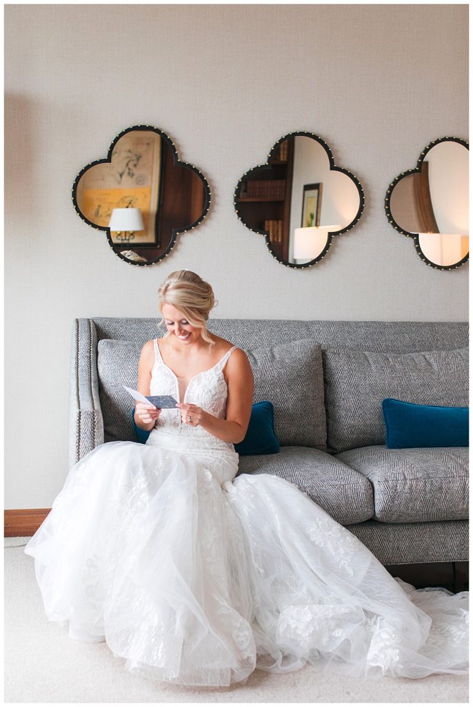 bride reading note in bridal suite