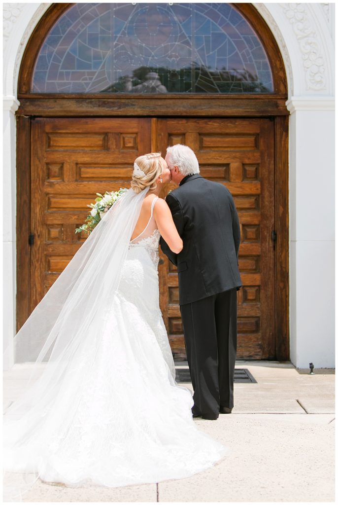 bride kisses dad before ceremony