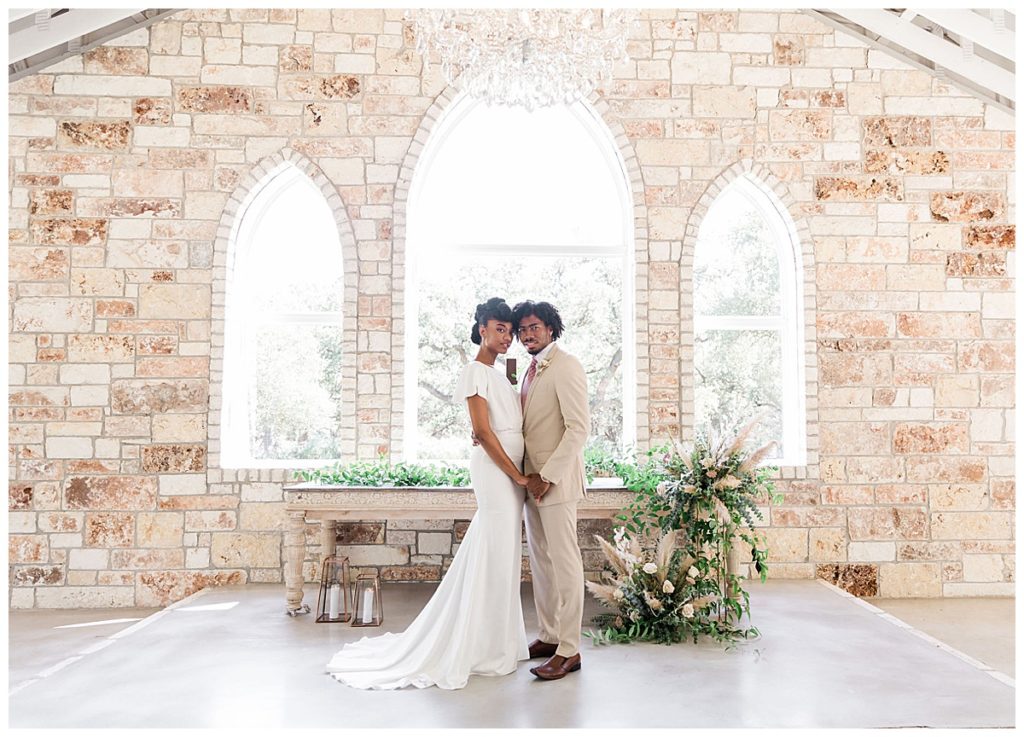 bride and groom standing in chapel