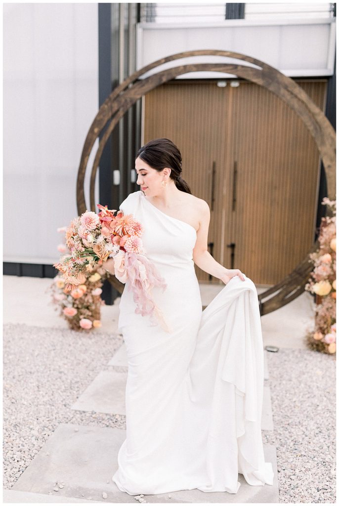 bride in front of greenhouse venue in Austin, TX