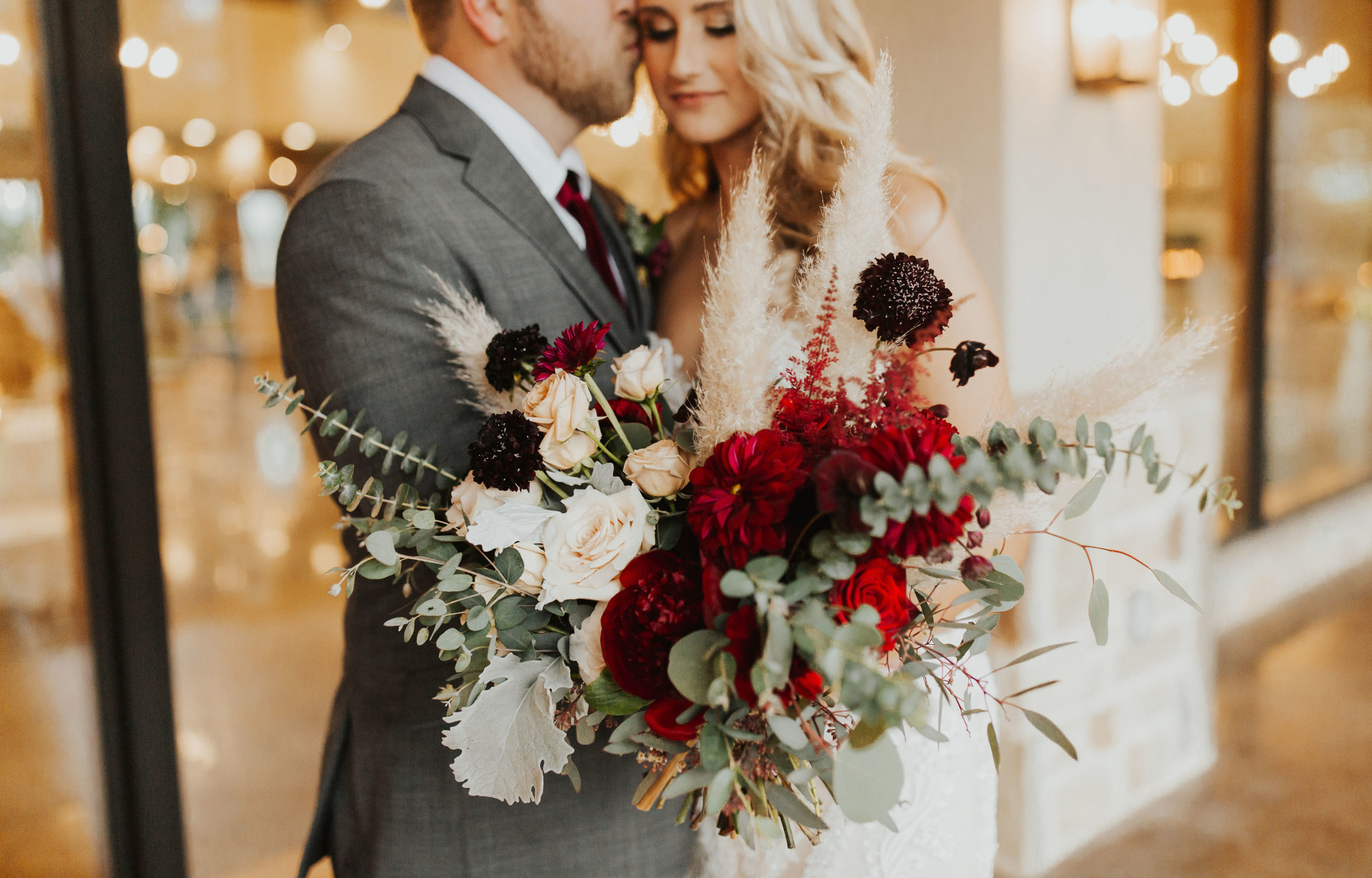 bride and groom embrace at dripping springs wedding venue