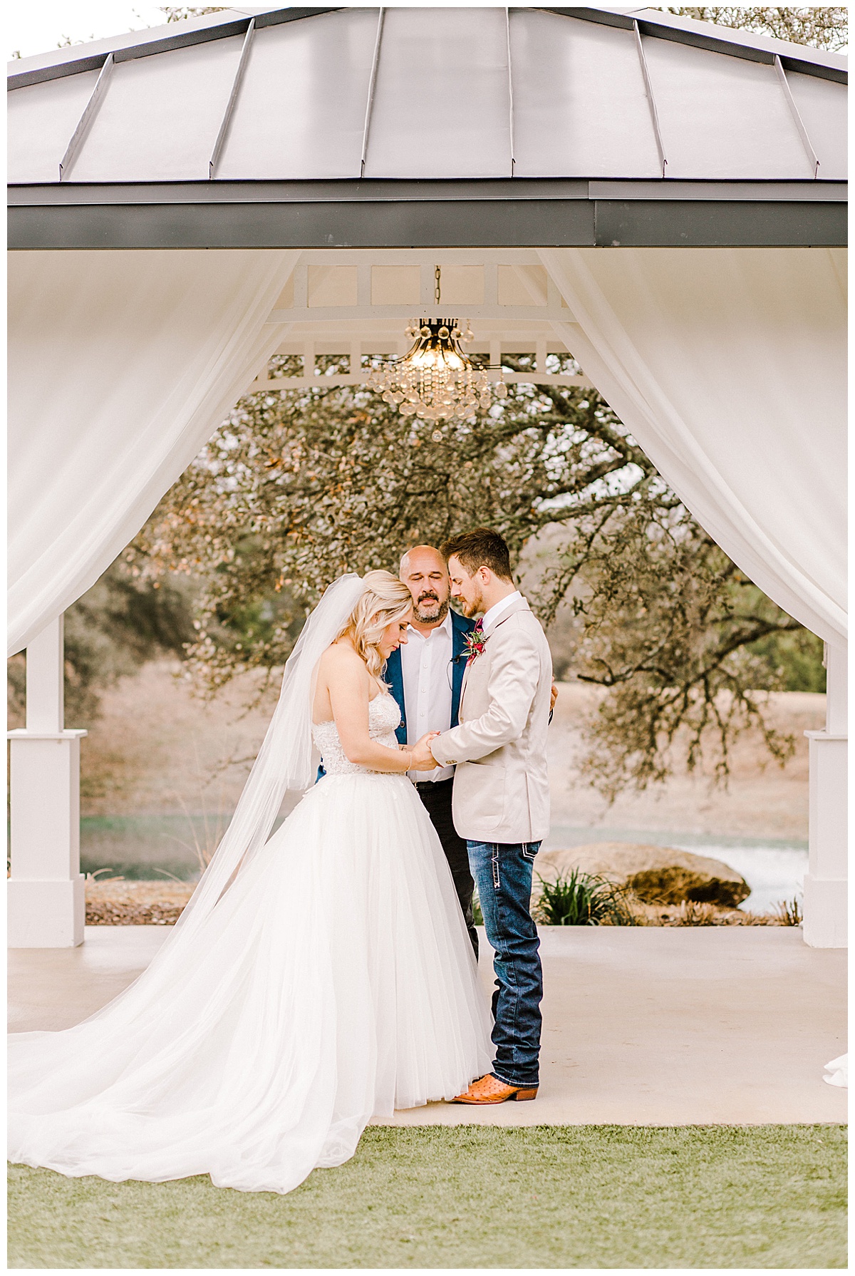 bride and groom praying at altar at boerne wedding venue