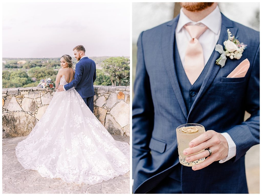 groom wearing navy suit holding cocktail