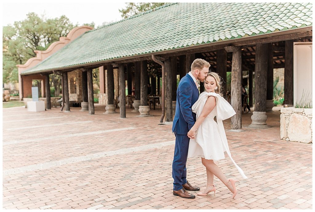 bride and groom in front of Camp Lucy pavilion