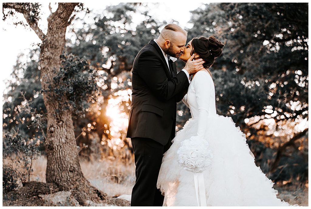 groom kissing bride at Park31 venue