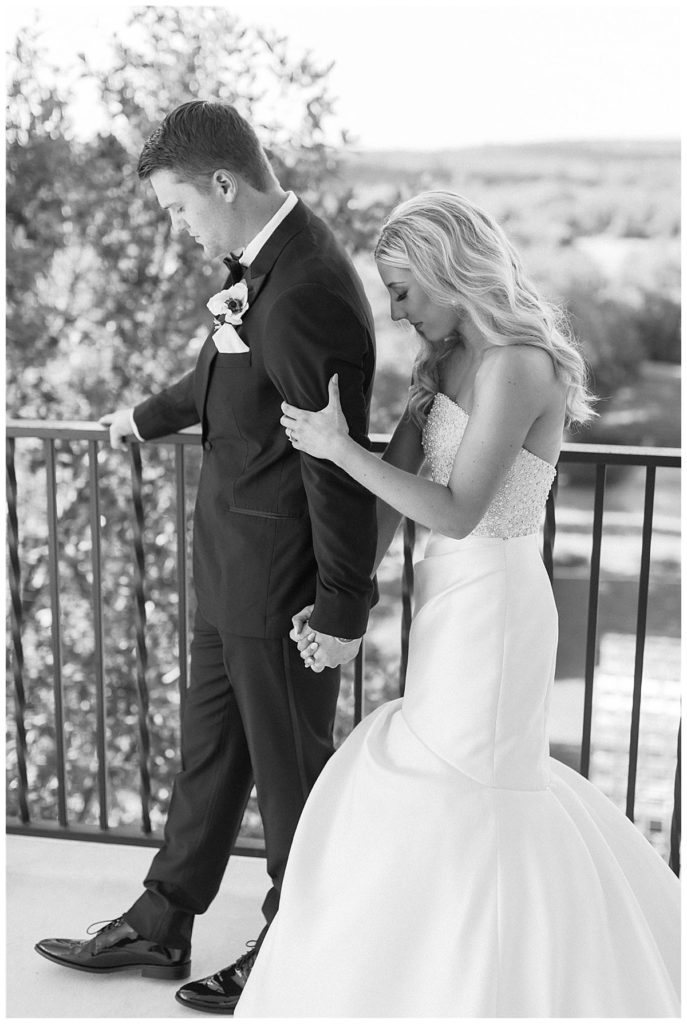 bride and groom first touch at Kendall Point wedding