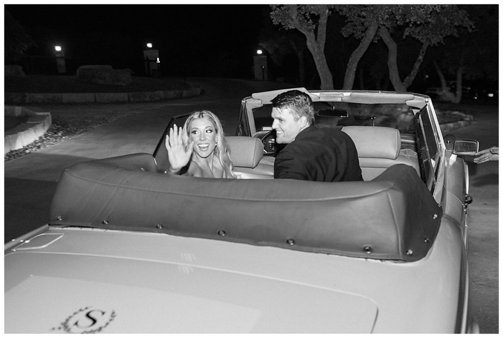 bride and groom in getaway car after Kendall Point wedding