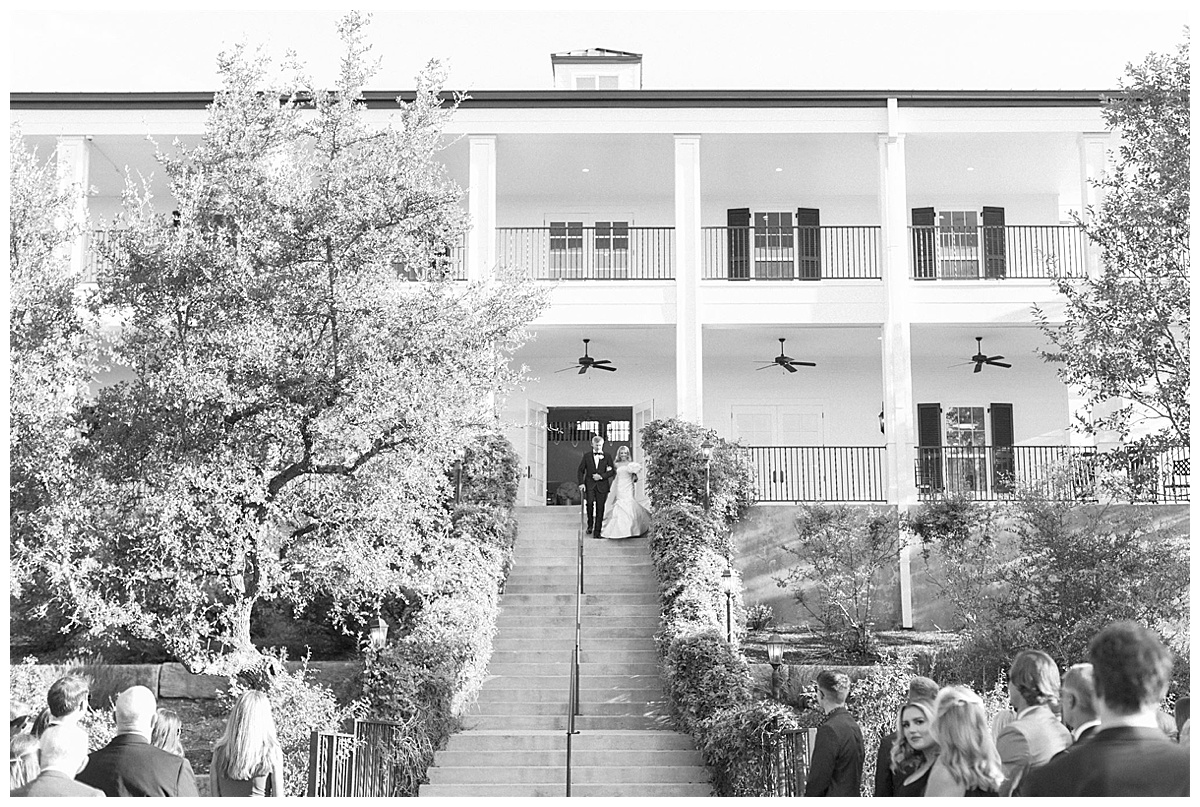 bride walking down Kendall Point stairs for ceremony