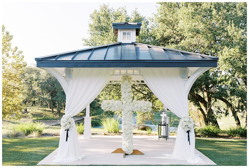 floral cross at Kendall Point venue outdoor wedding ceremony